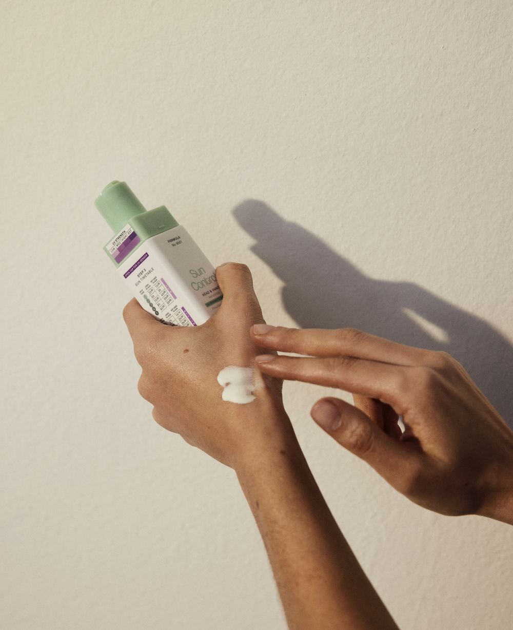Applying SunControl cream on hand